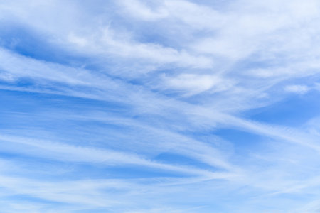 Blue sky background with white clouds. White fluffy clouds in the blue sky.の写真素材