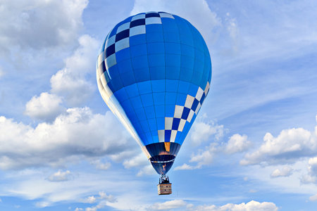 Hot air balloon in blue sky with white clouds.の写真素材