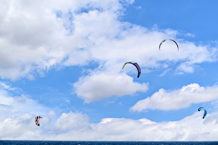 People practicing kitesurfing on the beach of Los CaÃ±os de Meca, next to the Trafalgar Lighthouse, Barbate, CÃ¡dizの写真素材