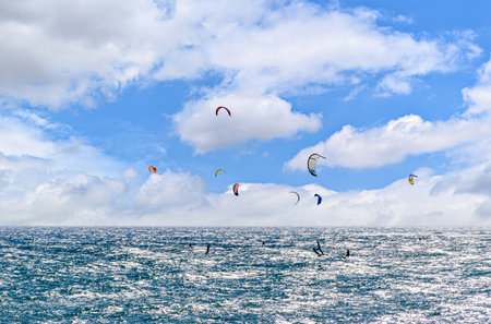 People practicing kitesurfing on the beach of Los CaÃ±os de Meca, next to the Trafalgar Lighthouse, Barbate, CÃ¡dizの写真素材