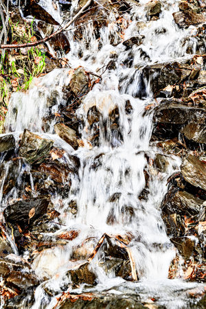 Waterfall, small water source on the slope of Lake Saint Maurice, in the Aigues Tortes National...