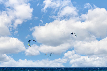 People practicing kitesurfing on the beach of Los CaÃ±os de Meca, next to the Trafalgar Lighthouse, Barbate, CÃ¡dizの写真素材