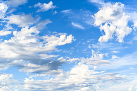 Blue sky background with tiny clouds. Natural sky background with tiny clouds.の写真素材