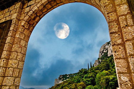 Views of the Montserrat massif, a mountain in the province of Barcelona, ââââCatalonia under the night moonの写真素材