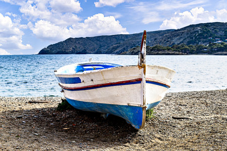 Typical fishing boat on the beach of the picturesque coastal town of Cadaques, Costa Brava, Gironaの写真素材