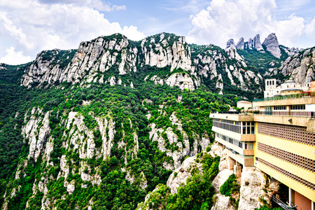 Views of the Montserrat massif, mountain in the province of Barcelona, ââCatalonia on a day with blue sky and white cloudsの写真素材