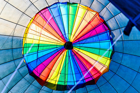 Preparing a hot air balloon to start the flight, heated by hot airの写真素材