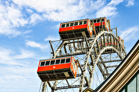 Ferris wheel with red cabins of the Prater amusement park in Vienna, Austria.の写真素材