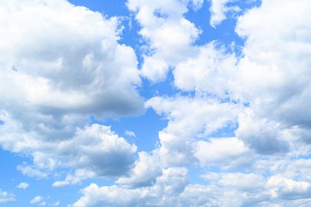 Blue sky background with white clouds. Cumulus white clouds in the blue sky.の写真素材