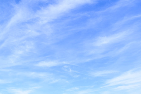 blue sky background with tiny clouds, soft focus, and copy spaceの写真素材