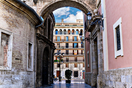 Valencia Corridor Arch, built between the Cathedral and the Basilica of Spain, in the old town of Valenciaの写真素材