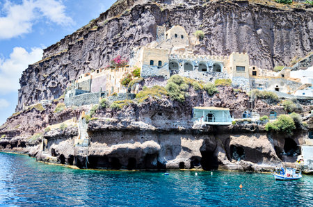 Traditional cave houses in the port of Fira, Santorini, Greeceの写真素材