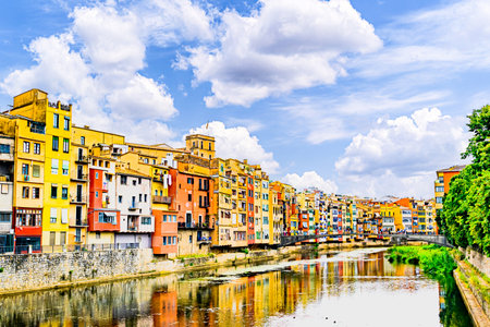 Colorful houses along the Onyar River in the city of Girona, Catalonia, Spainの写真素材