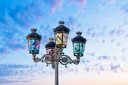 Lamppost decorated with colored glassの写真素材