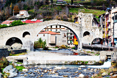 Image of the medieval Pont Nuovo (New Bridge) of Camprodon over the Ter River in RipollÃ¨s, Girona...