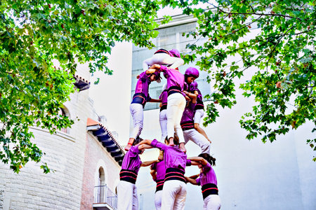 Igualada, Barcelona; August 23, 2025: Performance of the human tower by the Moixiganguers de...