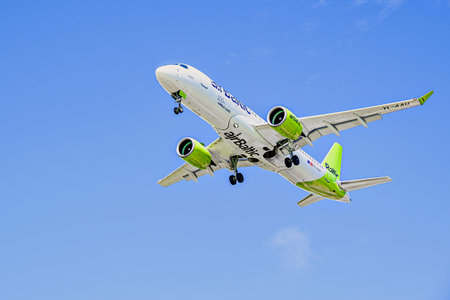 Barcelona, â€‹â€‹Spain; April 5, 2025: Air Baltic Airbus A220 landing at Barcelona-El Prat...