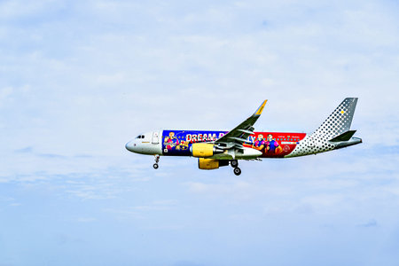 Barcelona, â€‹â€‹Spain; April 5, 2025: A Vueling Airbus A320 landing at Josep Tarradellas...