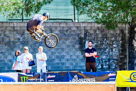 Igualada, Barcelona May 17, 2025: A young man practicing BMX and doing tricks in the skateparkのeditorial素材