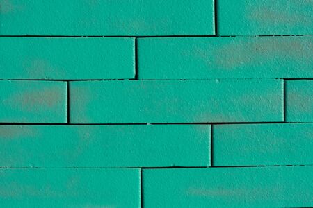 Textured wall of colored bricks