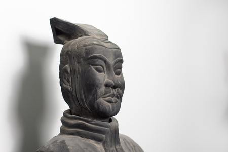 Half profile of Chinese terracotta warrior statue face, isolated on pure white backgroundのeditorial素材