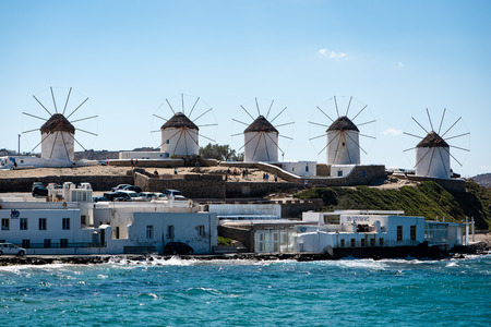 Five windmills on Mykonos with sea in foregroundのeditorial素材