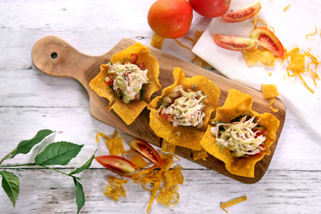 Pai Tee - Chicken & tomato salsa with wasabi mayo on a wonton skinの写真素材