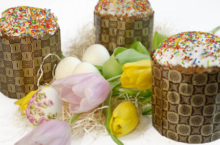 Easter composition of Easter cake, eggs and tulips