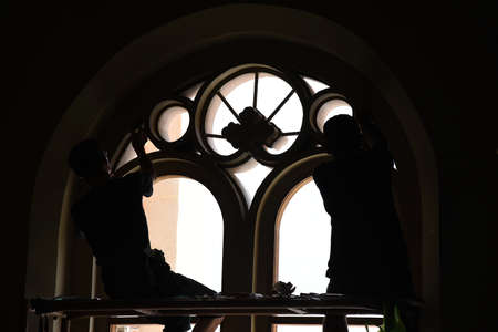 silhouette person stick glass in buildingの写真素材