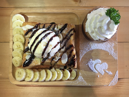 ice cream honey toast on wooden dishの写真素材