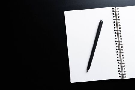 Black style set: notepad and pen on Black background.の写真素材