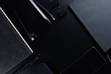 Black style set: notepad, pen and paper clips on Black background