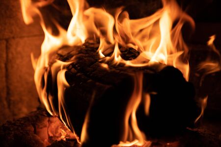 Burning wood in fire place.