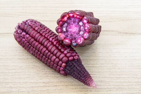 Purple corn on wooden on the tableの写真素材