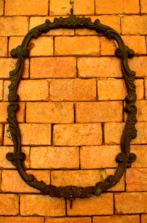 Brown stone plank wall with art iron frame texture backgroundの写真素材