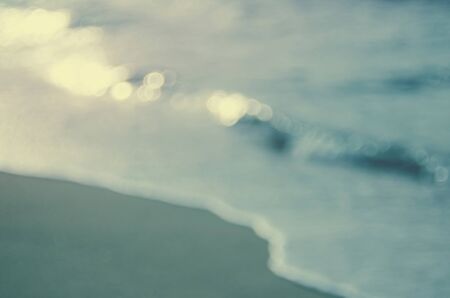 Blur bokeh wave beach abstract background.Retro color style.の写真素材