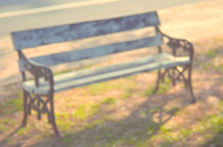 Blur outdoor chair in nature park abstract background.Retro color style.の写真素材