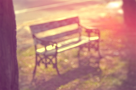Blur outdoor chair in nature park abstract background.Retro color style.の写真素材