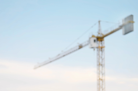 Blurred crane construction with blue sky abstract background.の写真素材