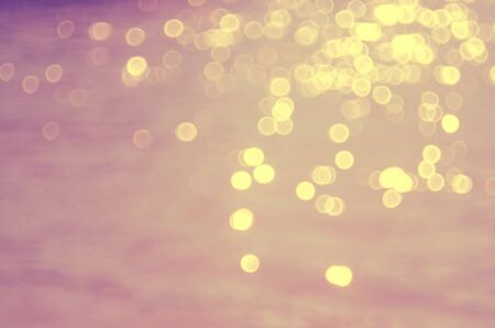 Blur bokeh smooth wave beach abstract background.Retro color style.の写真素材