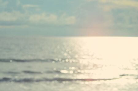 Blur tropical beach with bokeh wave abstract background.Retro color style.の写真素材