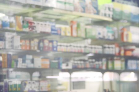 Blurred medicine on shelves.Drugstore background.Retro color style.の写真素材