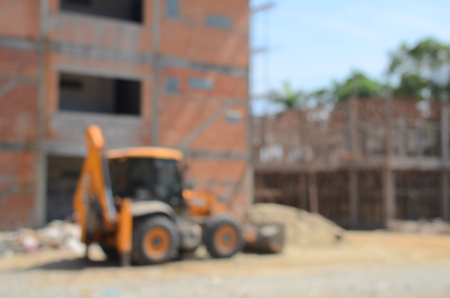 Blur construction site building incomplete and tractor abstract background.の写真素材