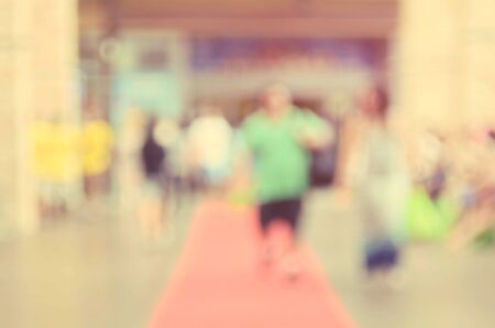 Blur people walking in shopping center mall abstract background.Retro color style.の写真素材