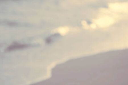 Blur bokeh smooth wave beach abstract background.Retro color style.の写真素材