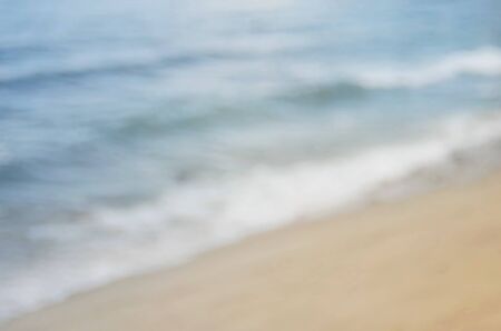 Blur tropical beach with bokeh wave abstract background.Retro color style.の写真素材