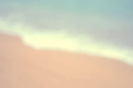 Blur bokeh smooth wave beach abstract background.Retro color style.の写真素材