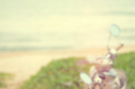 Blur motorcycle on sunset beach abstract background.Travel concept.Vintage color style.の写真素材