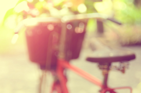 Blur old bicycle with flower basket abstract background.Vintage color style.の写真素材