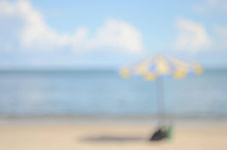 Blur umbrella on tropical beach abstract background.Travel concept.の写真素材